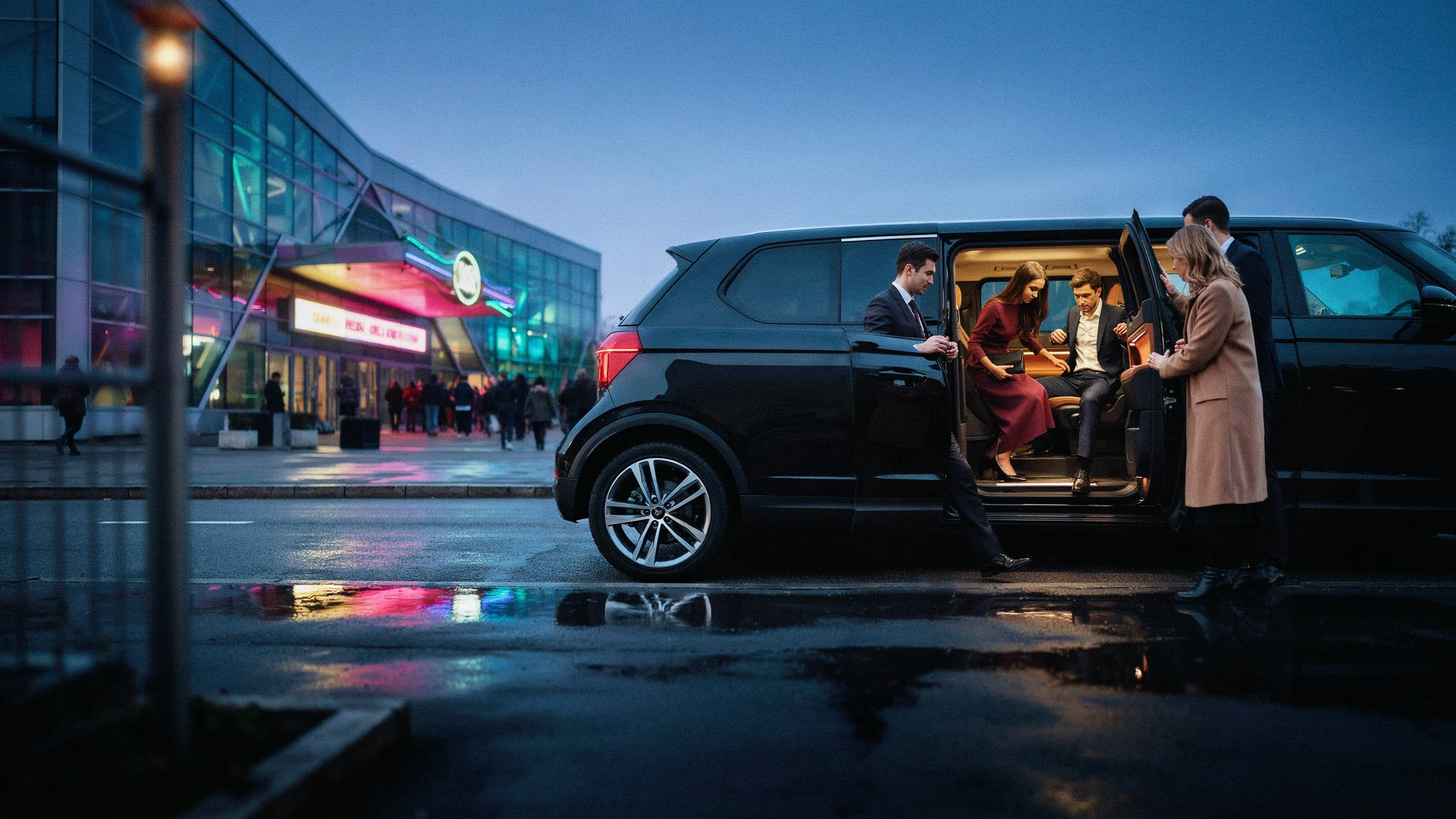Group of well-dressed guests stepping out of a black luxury van at dusk in front of a neon-lit concert venue